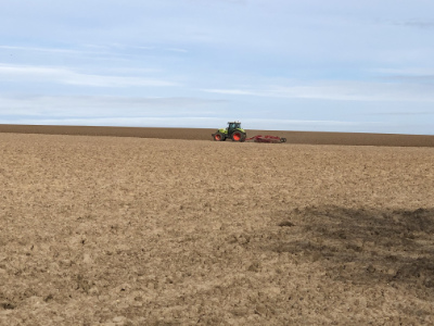 A tractor ploughing a field north side of Knapton